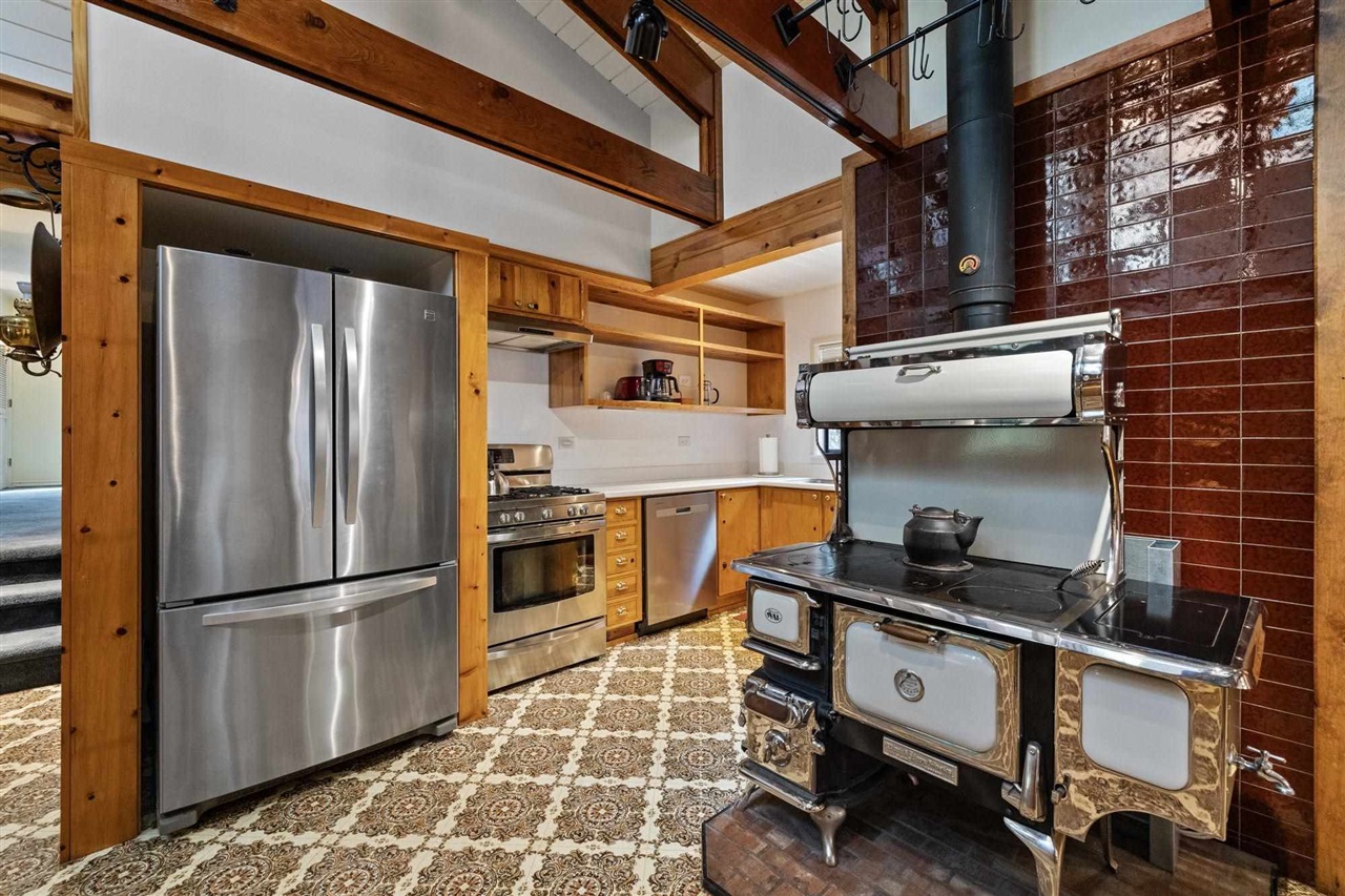 25833 Lyons Dam Road Twain Harte, CA 95383 - Photo 14 of 60 a kitchen with stainless steel appliances granite countertop a refrigerator and a stove