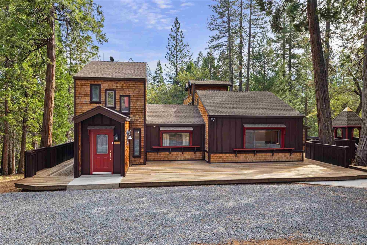 25833 Lyons Dam Road Twain Harte, CA 95383 - Photo 2 of 60 a view of a house with a yard and garage
