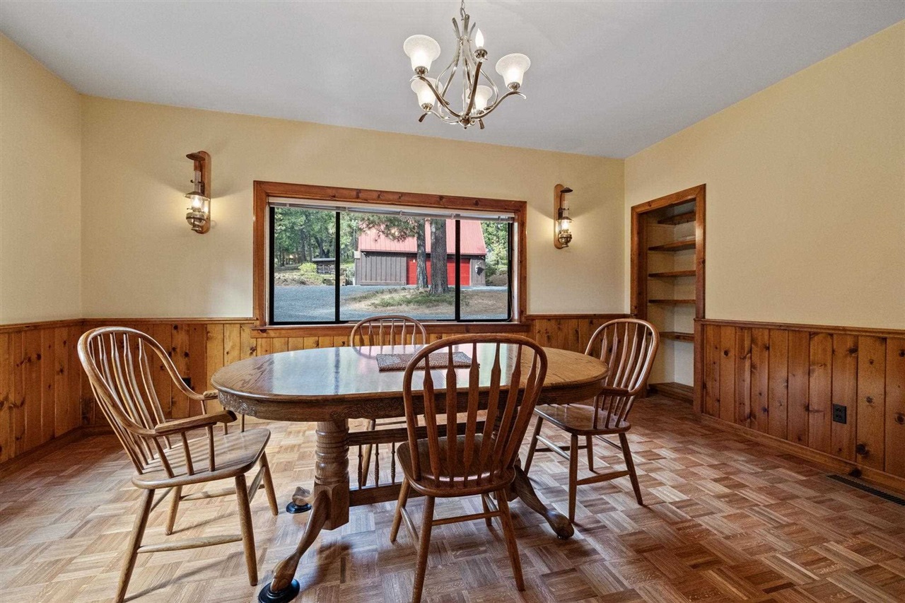 25833 Lyons Dam Road Twain Harte, CA 95383 - Photo 22 of 60 a view of a dining room with furniture window and wooden floor
