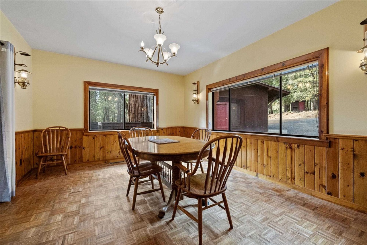 25833 Lyons Dam Road Twain Harte, CA 95383 - Photo 23 of 60 a view of a dining room with furniture window and outside view
