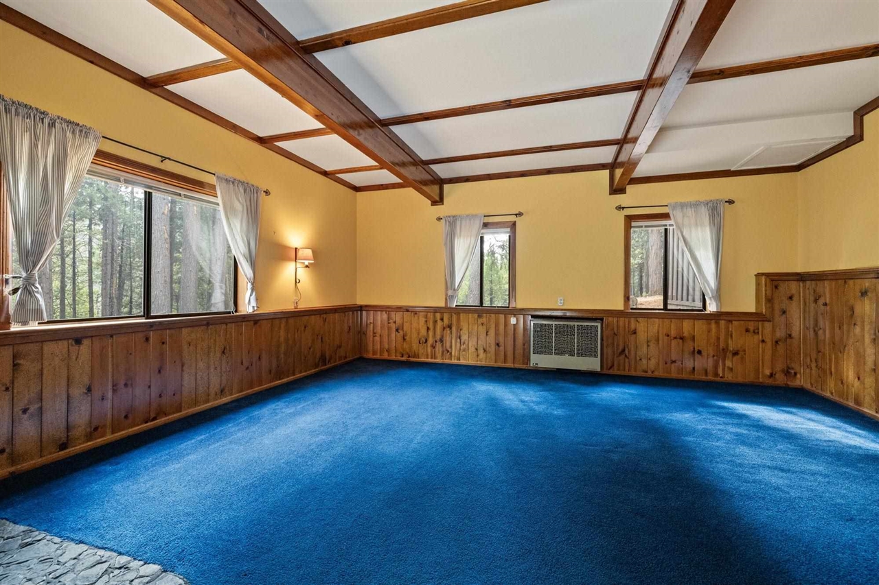 25833 Lyons Dam Road Twain Harte, CA 95383 - Photo 31 of 60 a view of an empty room with wooden floor and a window