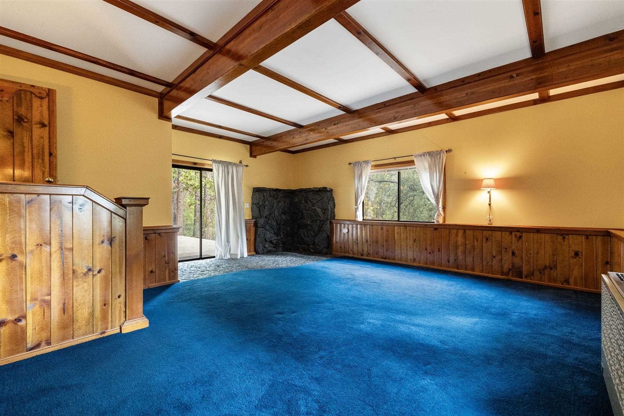 25833 Lyons Dam Road Twain Harte, CA 95383 - Photo 32 of 60 a view of an empty room with wooden floor and windows