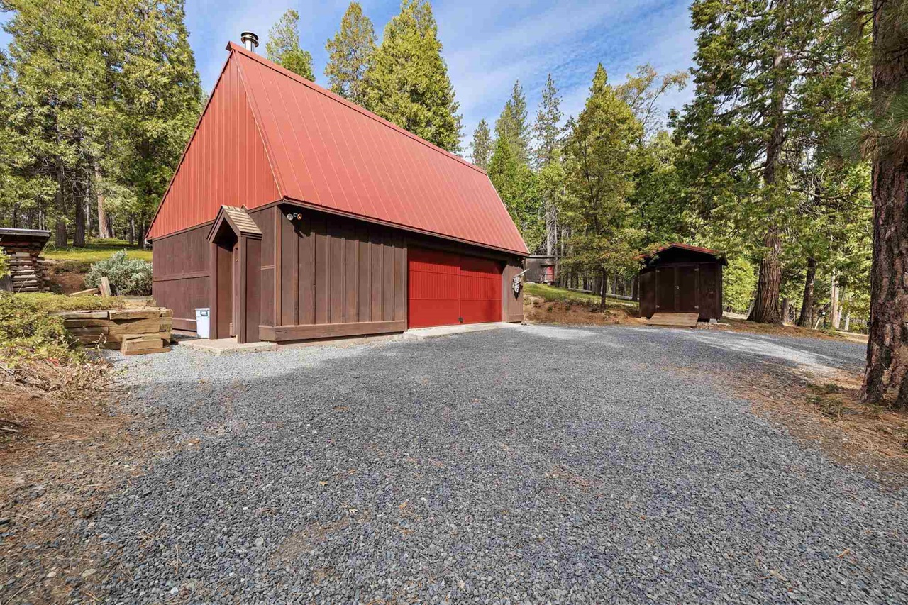 25833 Lyons Dam Road Twain Harte, CA 95383 - Photo 40 of 60 a view of a house with a yard and garage