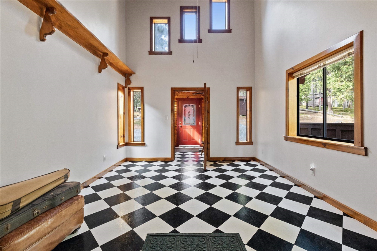 25833 Lyons Dam Road Twain Harte, CA 95383 - Photo 5 of 60 a front view of a house with a black and white checkered floor
