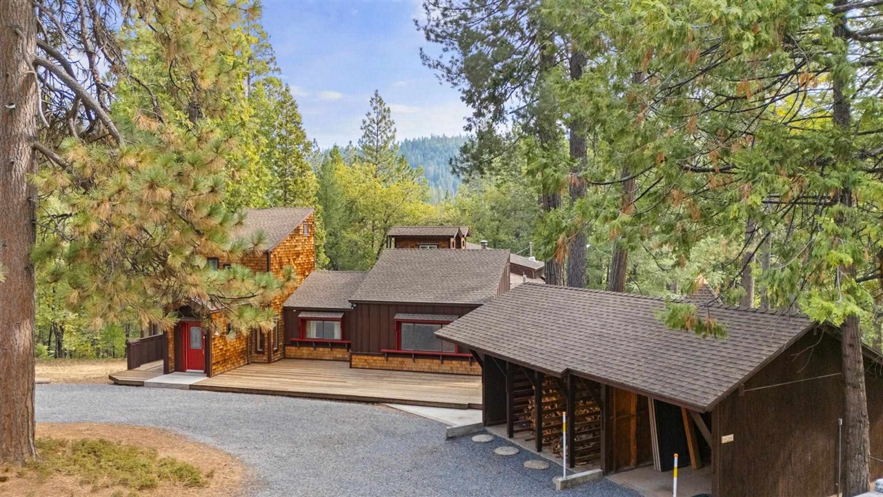 25833 Lyons Dam Road Twain Harte, CA 95383 - Photo 54 of 60 front view of a house with a table and chair