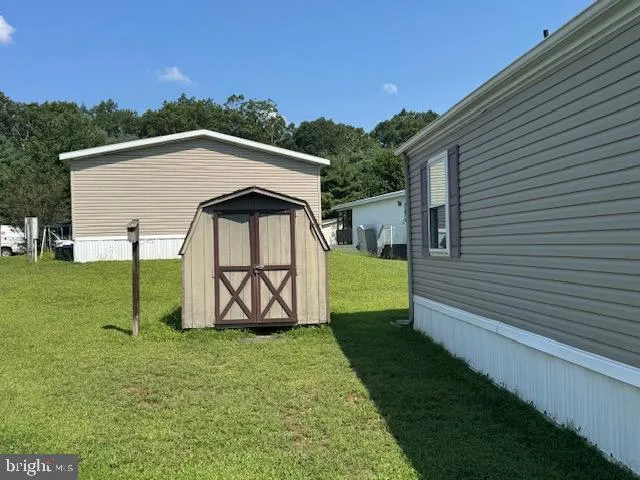 a view of backyard with a garden and entertaining space
