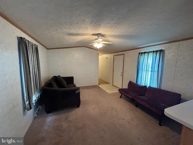 a living room with hard wood flooring and a couch