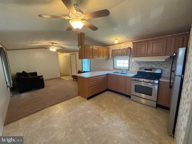 a kitchen with a stove and a microwave