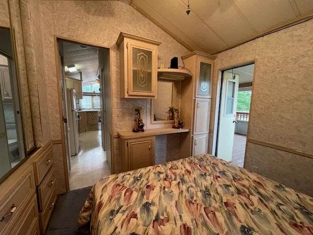 a bathroom with a shower toilet and sink