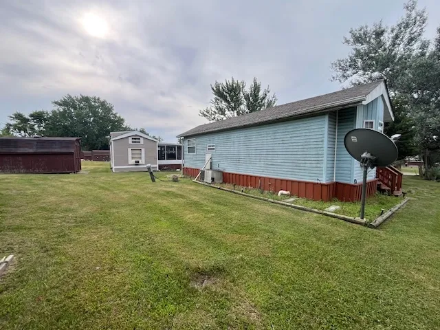 a view of a house with a backyard