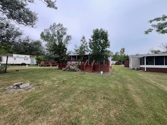 a view of a house with a backyard