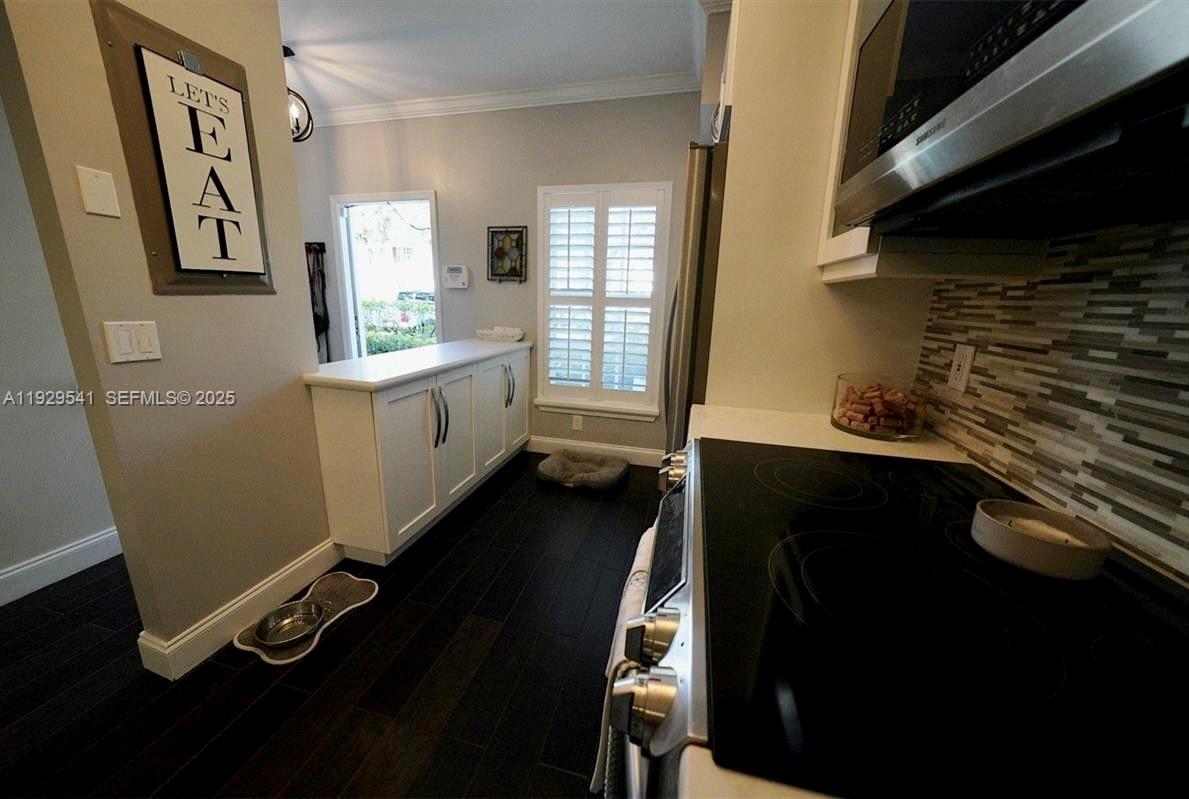 171 Southwest 96th Avenue Plantation, FL 33324 - Photo 5 of 24 a bathroom with a sink a mirror and a toilet