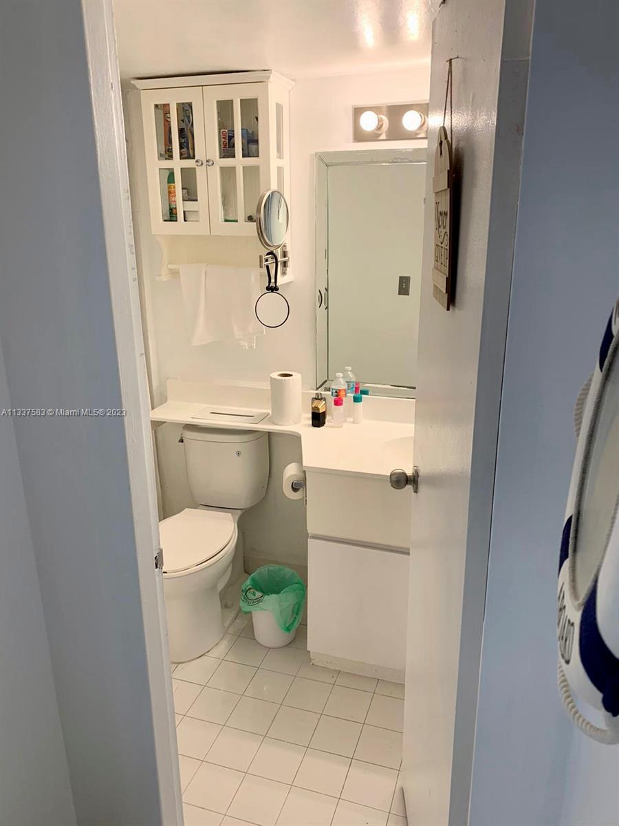 19201 Collins Avenue, Unit 906 Sunny Isles Beach, FL 33160 - Photo 11 of 19 a bathroom with a sink toilet and shower