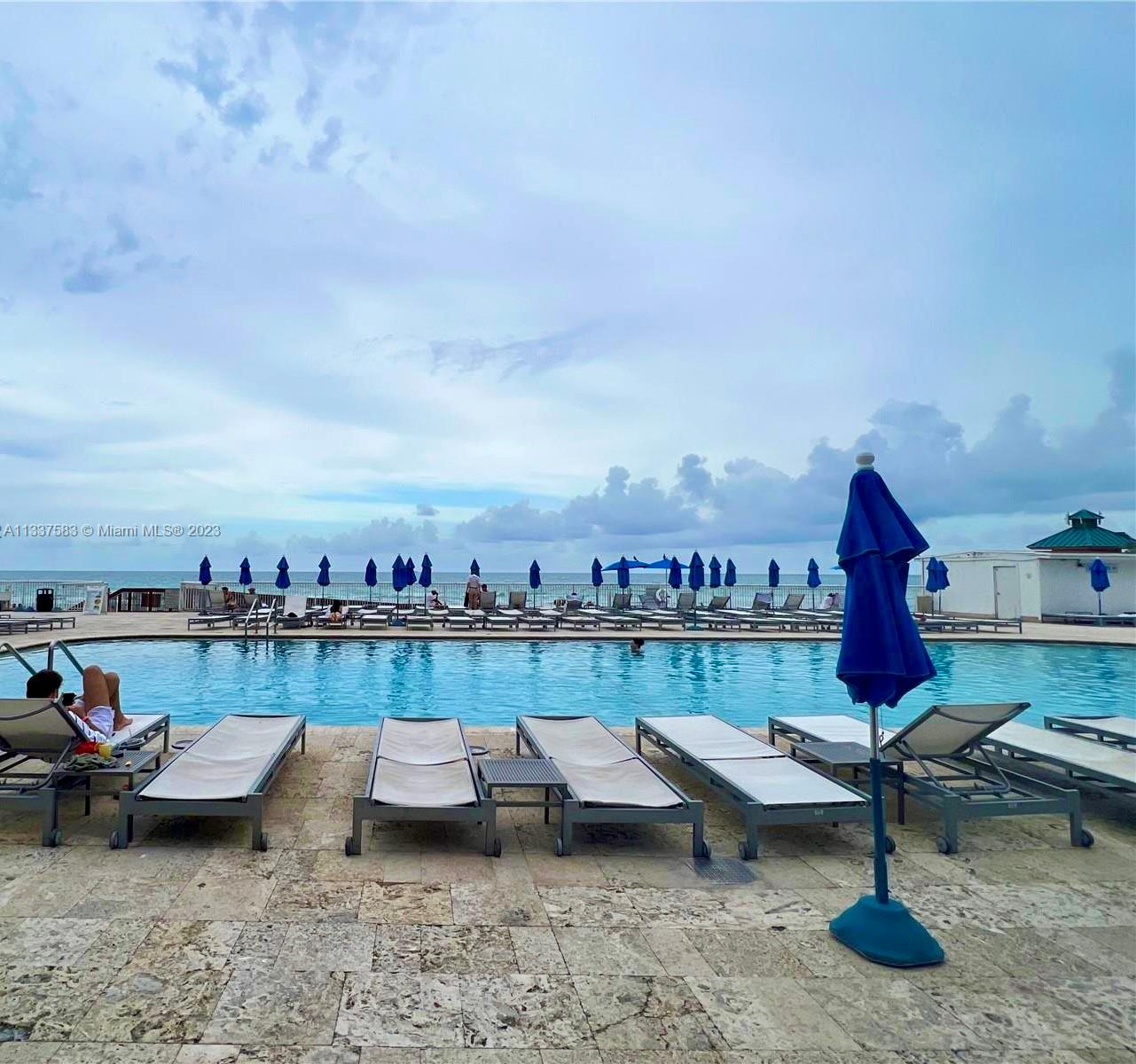 19201 Collins Avenue, Unit 906 Sunny Isles Beach, FL 33160 - Photo 13 of 19 a view of a terrace with sitting area
