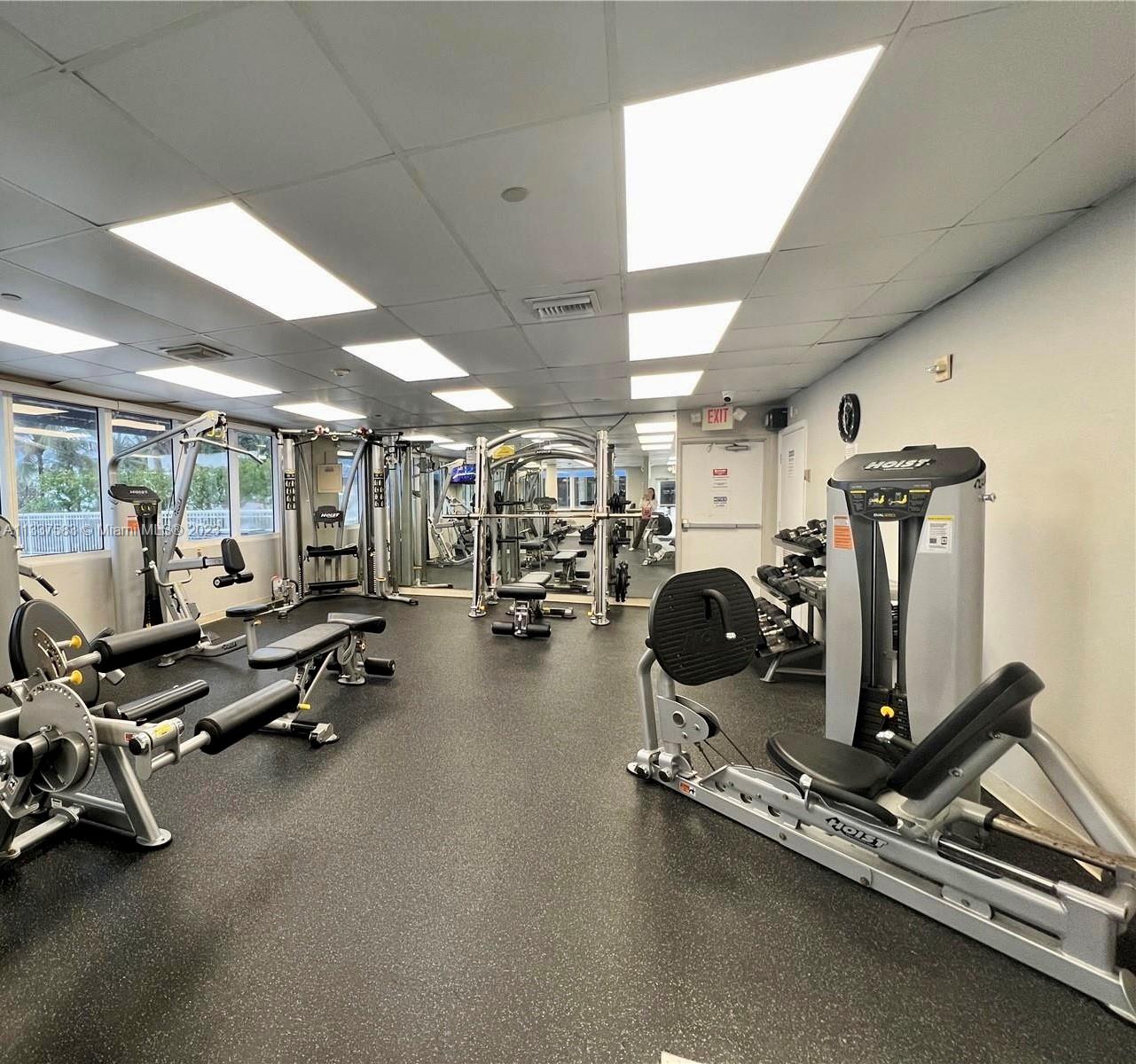 19201 Collins Avenue, Unit 906 Sunny Isles Beach, FL 33160 - Photo 14 of 19 a view of a room with gym equipment