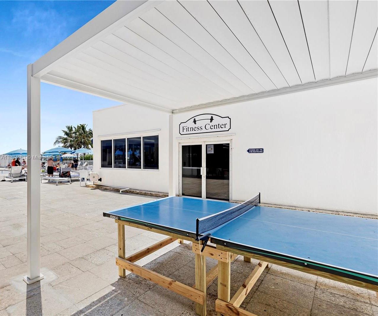 19201 Collins Avenue, Unit 906 Sunny Isles Beach, FL 33160 - Photo 17 of 19 a view of kitchen with furniture and wooden floor
