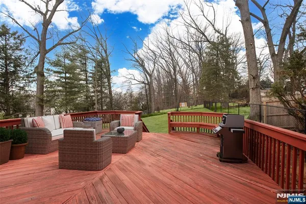 a view of a deck with couches and wooden floor