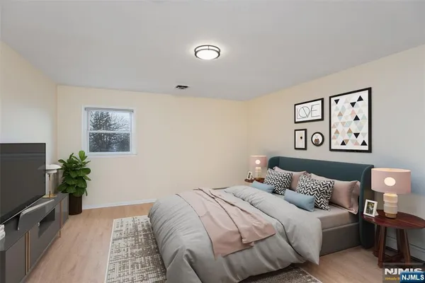 a bedroom with a bed and a couch