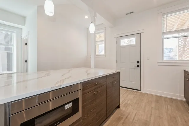 a view of a kitchen cabinets and wooden floor