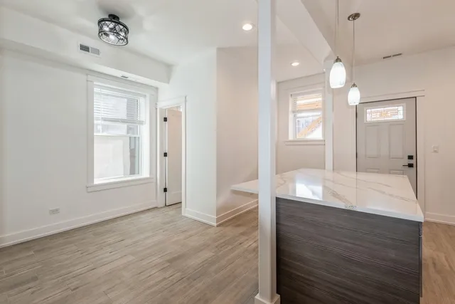 a bathroom with mirror and a sink