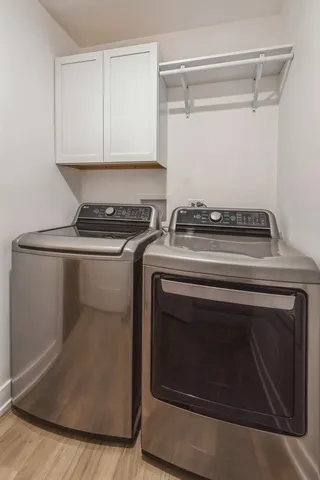 a stove top oven sitting inside of a kitchen