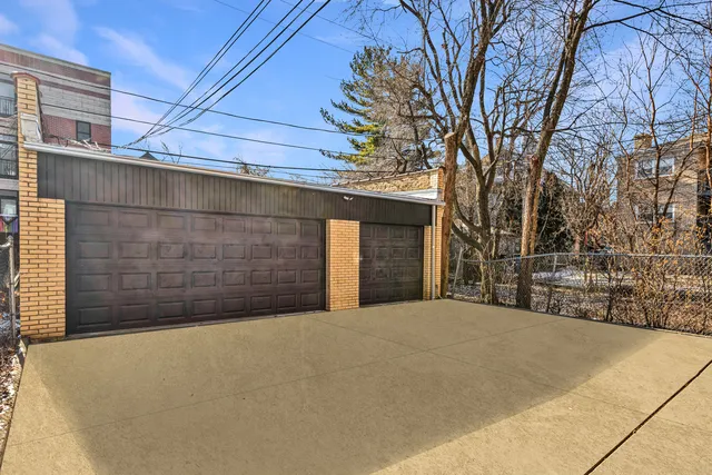 a front view of a house with a large window