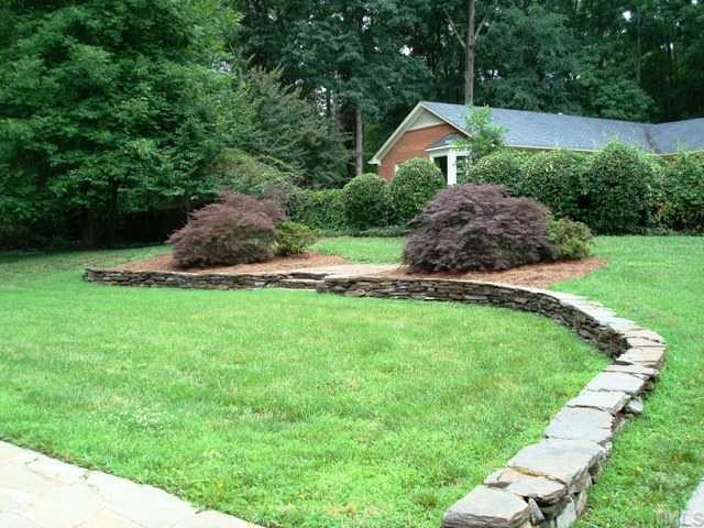 3700 St Marks Road Durham, NC 27707 - Photo 12 of 12 Handsome stone decorator wall in backyard.