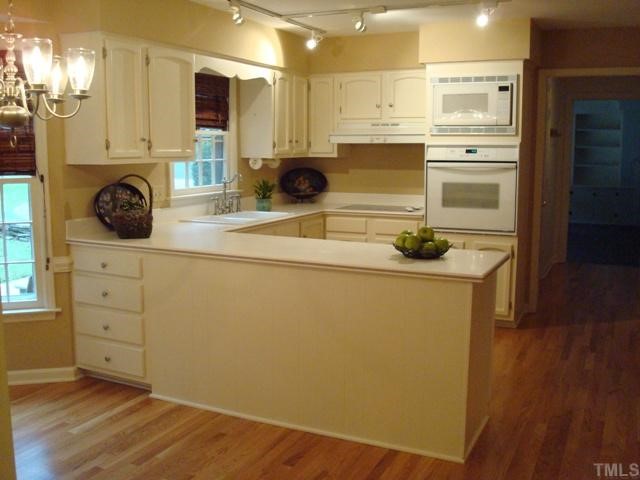 3700 St Marks Road Durham, NC 27707 - Photo 6 of 12 Kitchen eat-in area with door to backyard