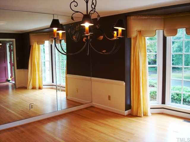 3700 St Marks Road Durham, NC 27707 - Photo 8 of 12 Dining Room recently painted with one wall of mirrors and bay window.