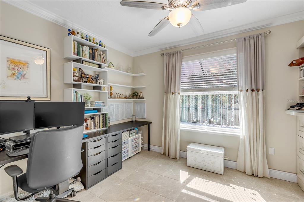 2504 Lime Tree Drive Edgewater, FL 32141 - Photo 20 of 42 a view of a workspace with furniture and a window
