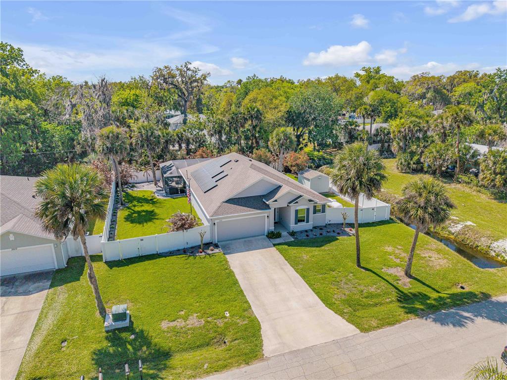 2504 Lime Tree Drive Edgewater, FL 32141 - Photo 2 of 42 a view of a swimming pool with a patio