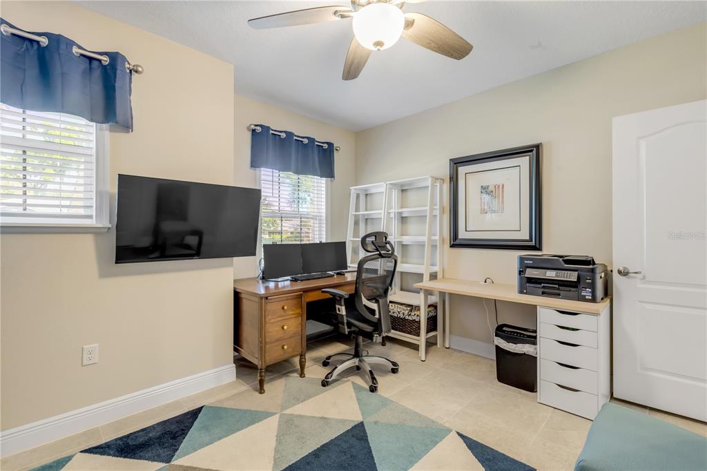 2504 Lime Tree Drive Edgewater, FL 32141 - Photo 23 of 42 a view of a workspace with furniture and a window