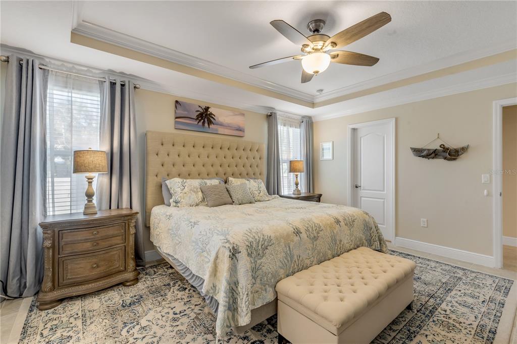 2504 Lime Tree Drive Edgewater, FL 32141 - Photo 28 of 42 a bedroom with a bed and a chandelier