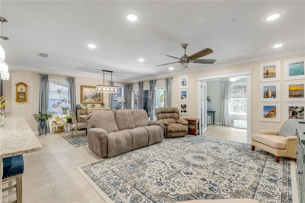 2504 Lime Tree Drive Edgewater, FL 32141 - Photo 5 of 42 a living room with furniture and wooden floor