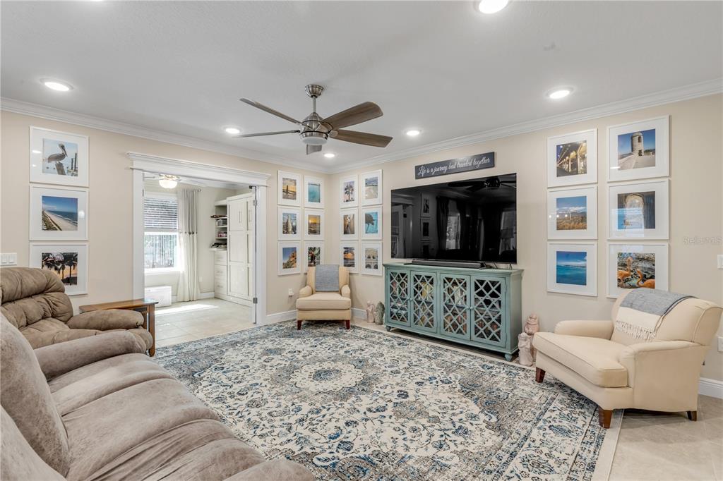 2504 Lime Tree Drive Edgewater, FL 32141 - Photo 6 of 42 a living room with furniture and a flat screen tv