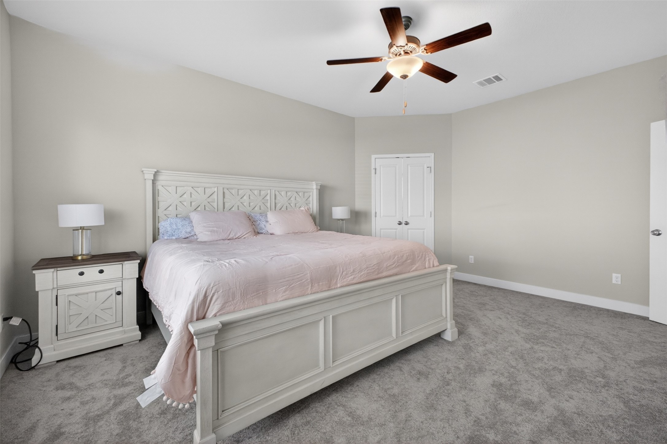 1009 Bright Star Cove Georgetown, TX 78628 - Photo 10 of 40 a bed room with a bed and a ceiling fan