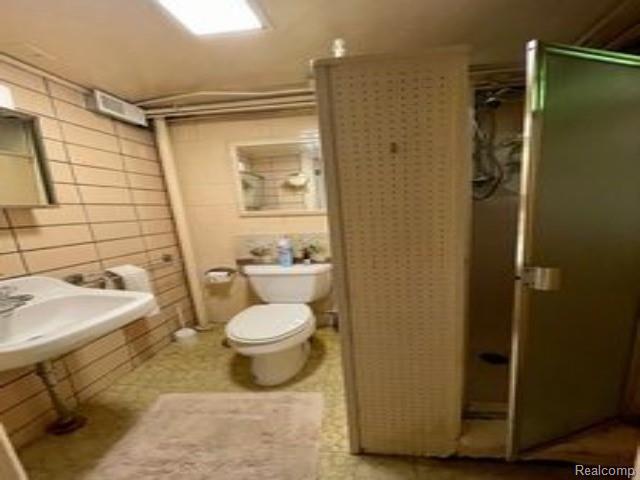2106 Tecumseh River Road Lansing, MI 48906 - Photo 23 of 33 24-basement bath.jpg