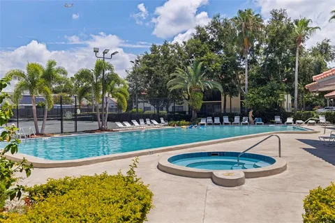 a view of a swimming pool with a patio