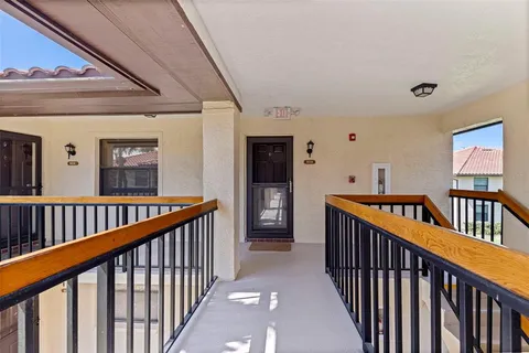 a view of staircase with railing and stairs