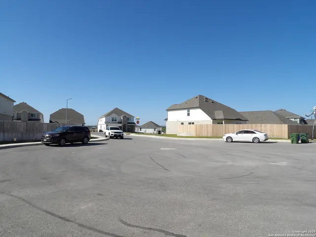 a view of multiple houses with a street