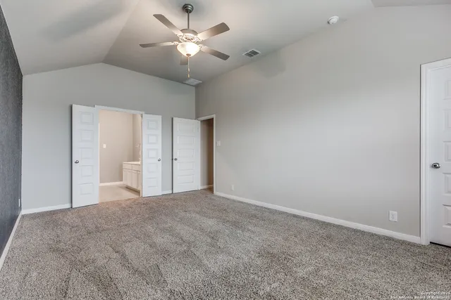 a view of a big room with carpet