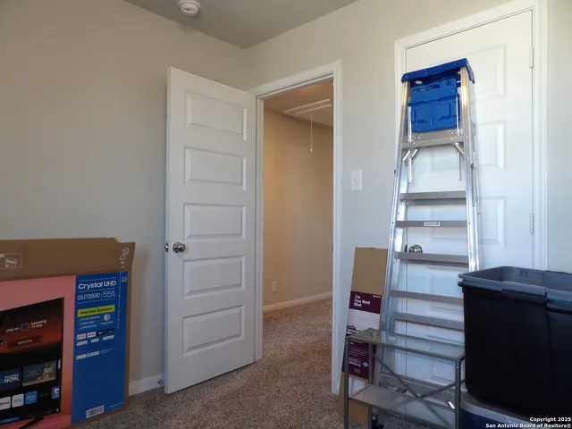 a room that has a dresser and a chair in it