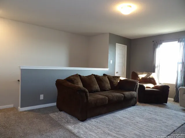 a living room with furniture and a couch