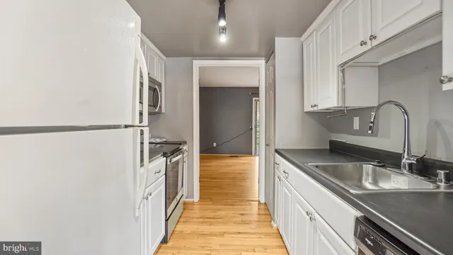 a bathroom with a sink and a large mirror