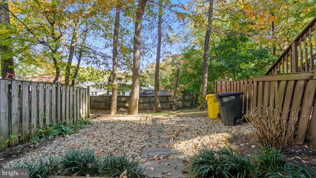 a view of a outdoor space with wooden fence