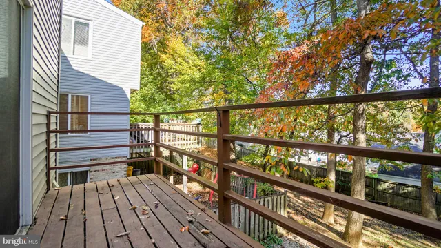 a view of a balcony with wooden floor