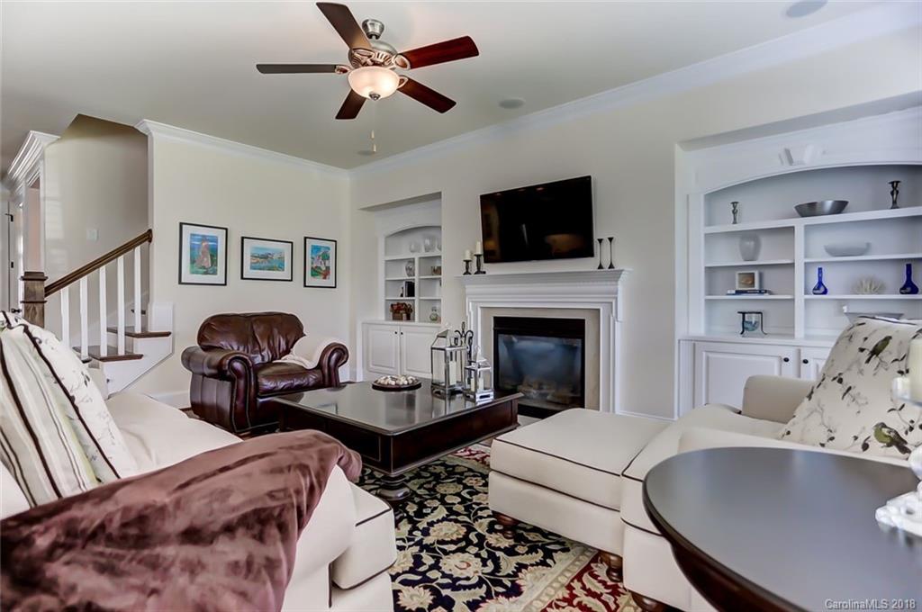 754 Revival Row Fort Mill, SC 29708 - Photo 11 of 35 a living room with furniture fireplace and a flat screen tv