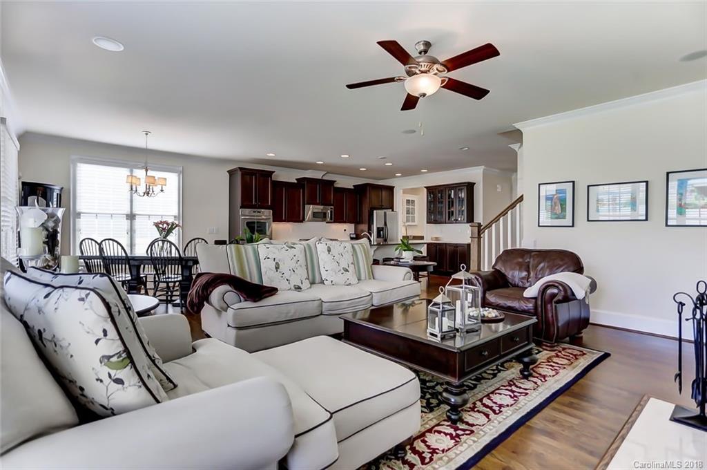 754 Revival Row Fort Mill, SC 29708 - Photo 12 of 35 a living room with furniture a ceiling fan and a rug