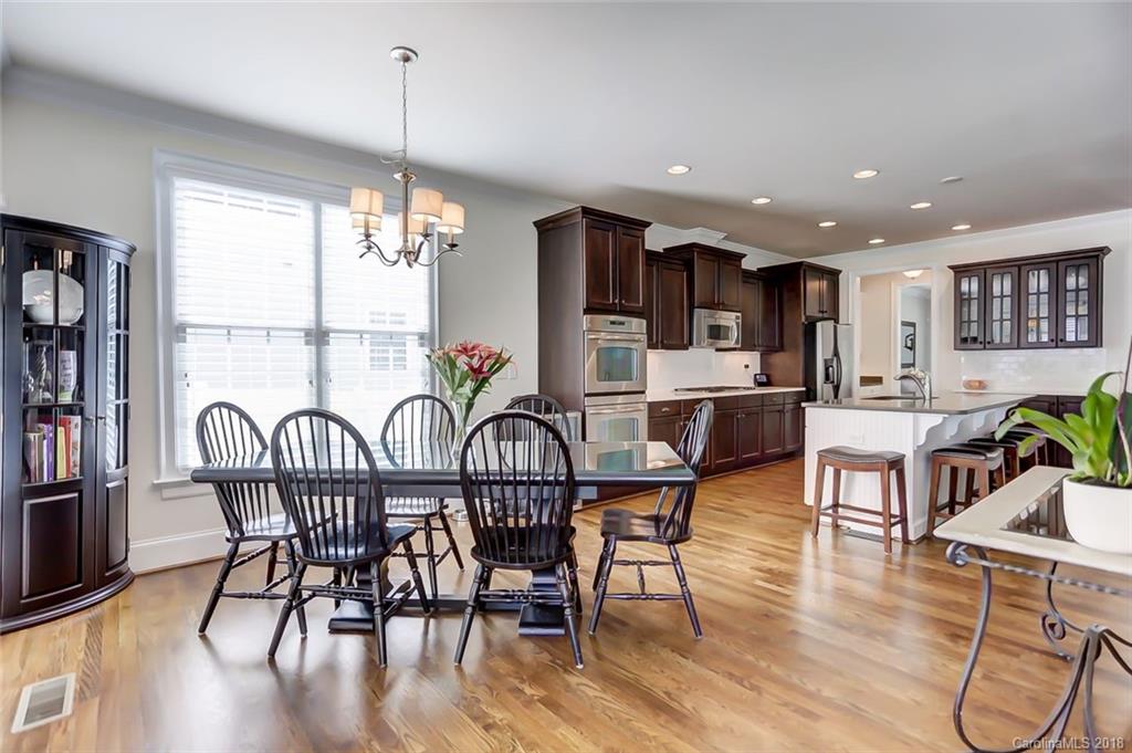 754 Revival Row Fort Mill, SC 29708 - Photo 13 of 35 a dining room with furniture and wooden floor