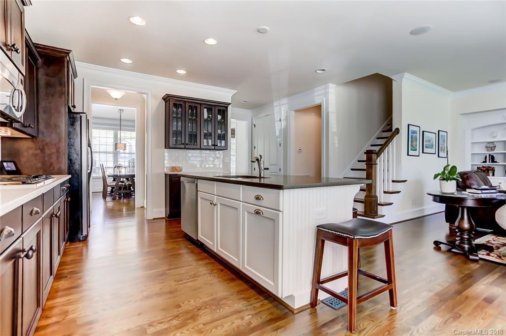 754 Revival Row Fort Mill, SC 29708 - Photo 15 of 35 a kitchen with sink cabinets and wooden floor